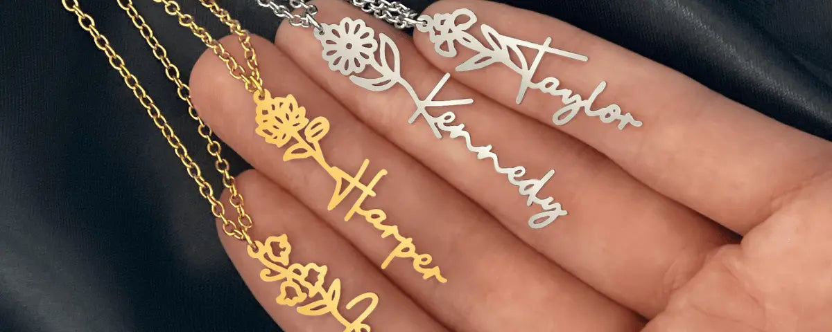 three gold birth flower name necklaces engraved taylor, kennedy and harper, layered together